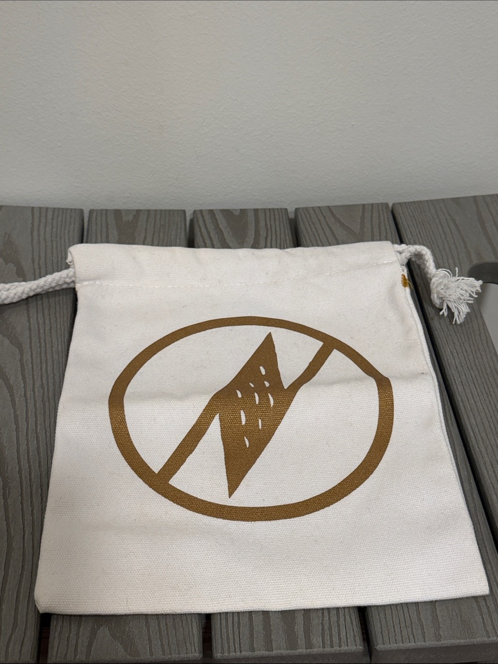 Manaola Cream Canvas Drawstring Pouch with Gold Logo Print
